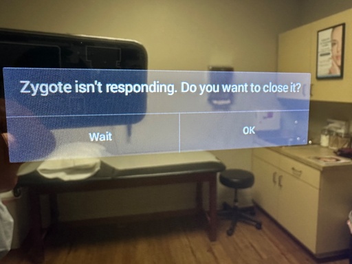Photo of a readout on an educational display at a doctor’s office reading “Zygote isn’t responding. do you want to close it?”